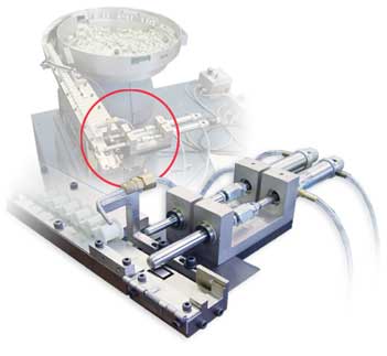 Inline vibratory feeder hold and release escapement, spring loaded.